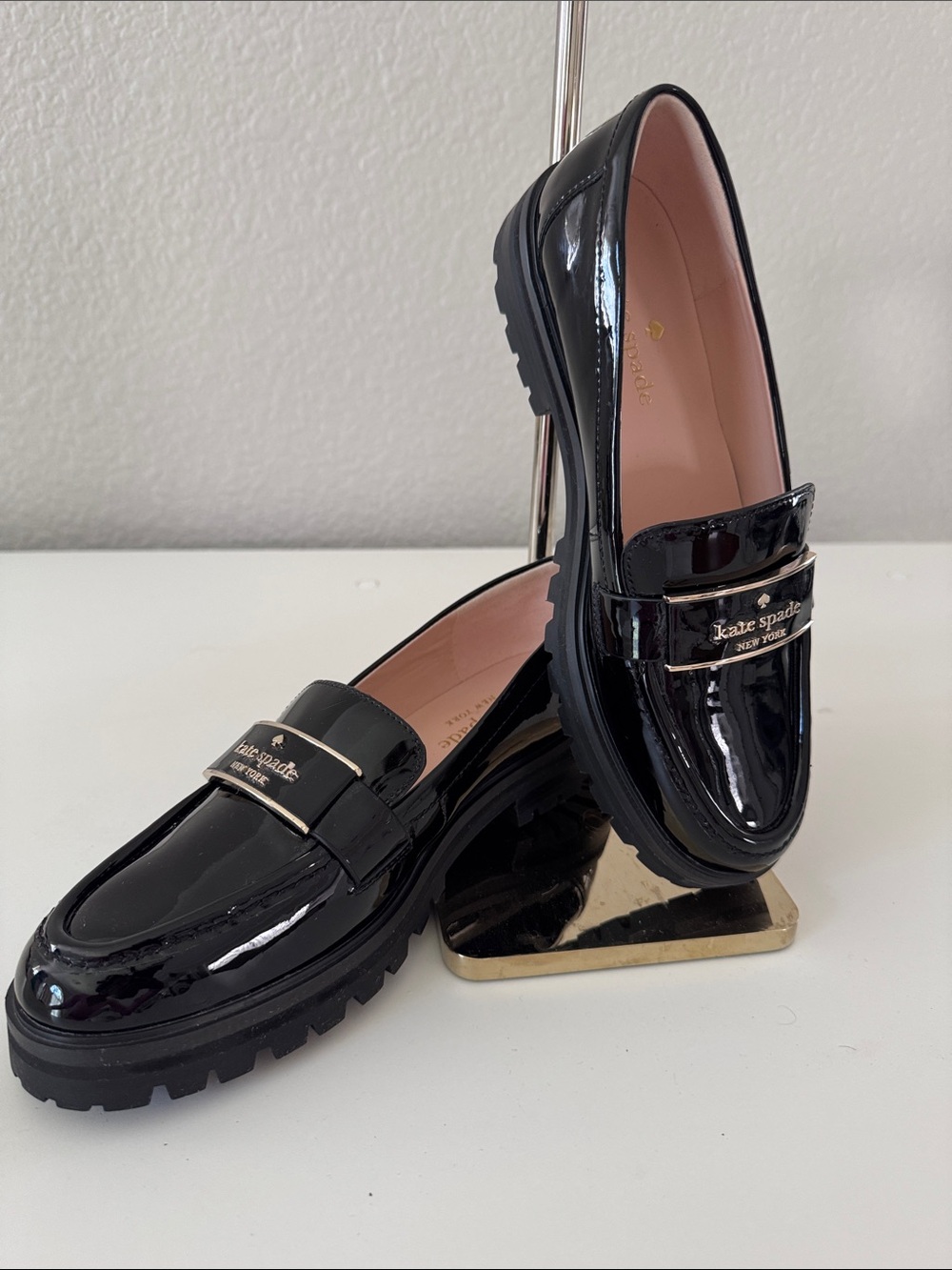 kate spade Black Patent Leather Lug Sole Loafers with Gold Logo Bar